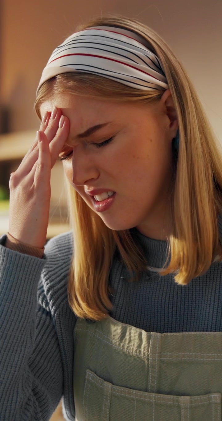 Young Woman Suffering From a Severe Headache