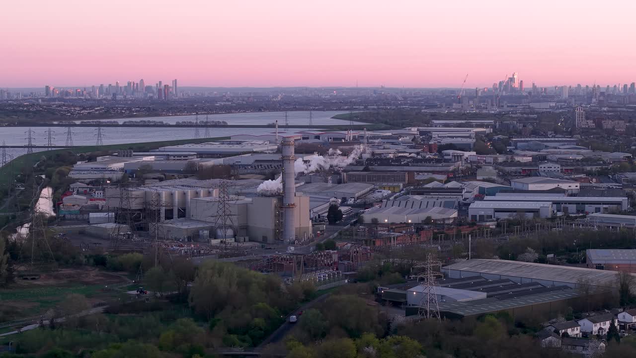 Enfield power station aerial view across industrial factory under purple sunset London skyline