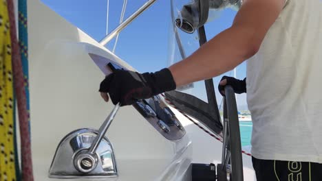 person steering a yacht