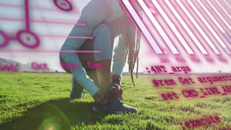 animation of data processing over african american man tying shoe lace by field