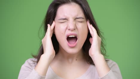 young stressed woman having headache