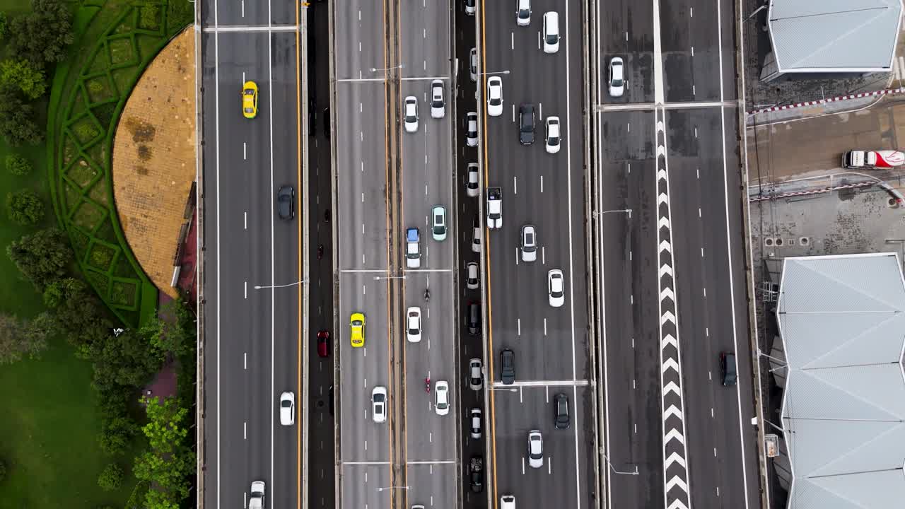 Aerial birds eye view timelapse cars driving on busy multi lane highway