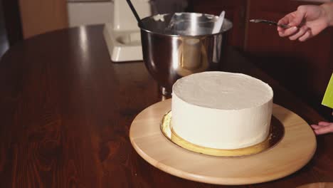 decorating a cake with buttercream