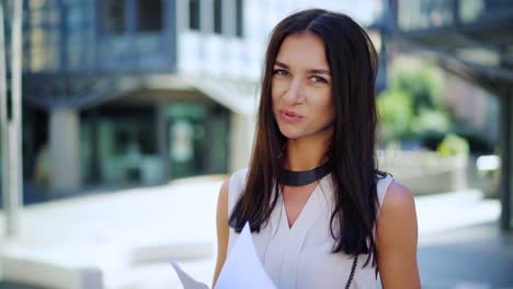 portrait of a fashionable young professional woman. attractive young caucasian businesswoman outside office building