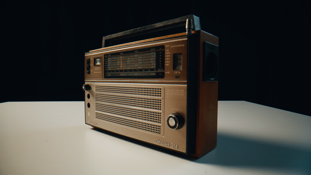 Closeup waves receiver panel in dark room. Retro signal box delivering music