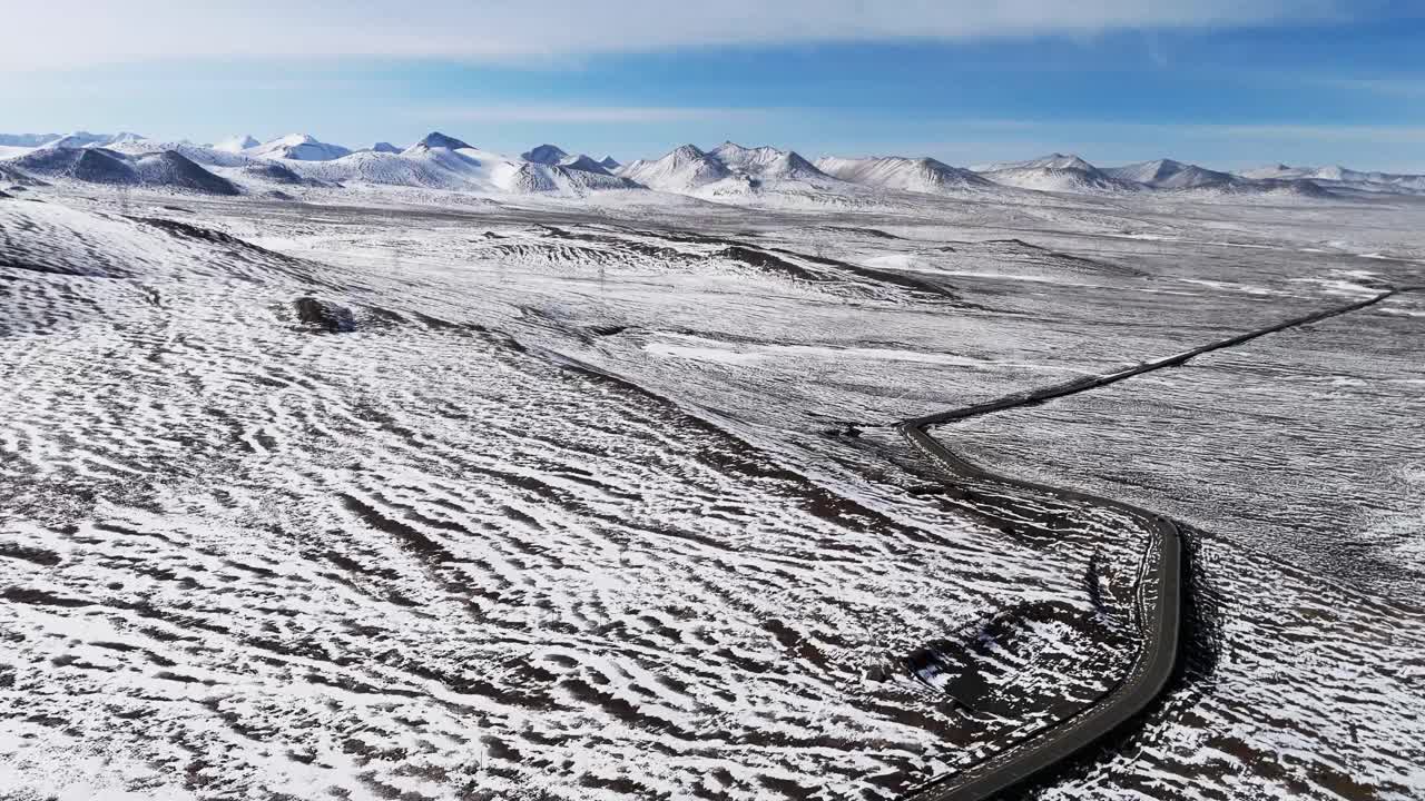 Drone fly road to Mount Everest landscape, empty pathway crossing Himalayas mountains under the snow