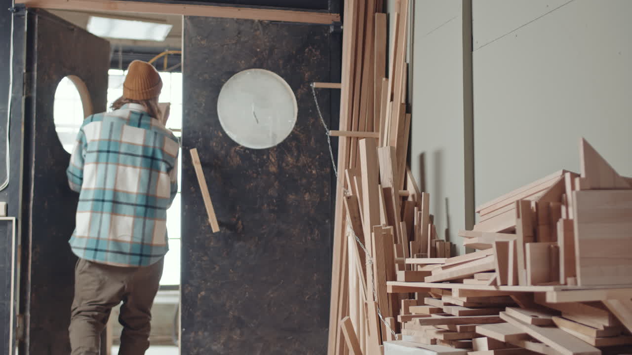 Carpenter Choosing Wood for Work