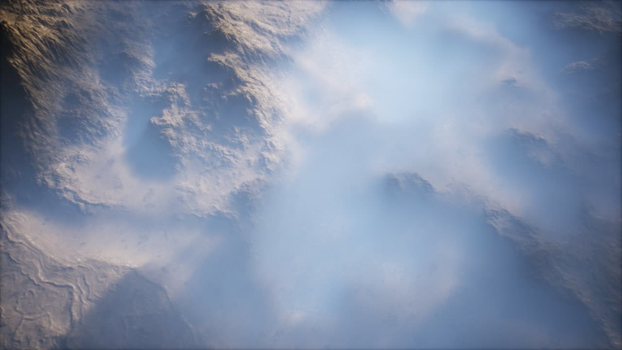 Distant mountain range and thin layer of fog on the valleys