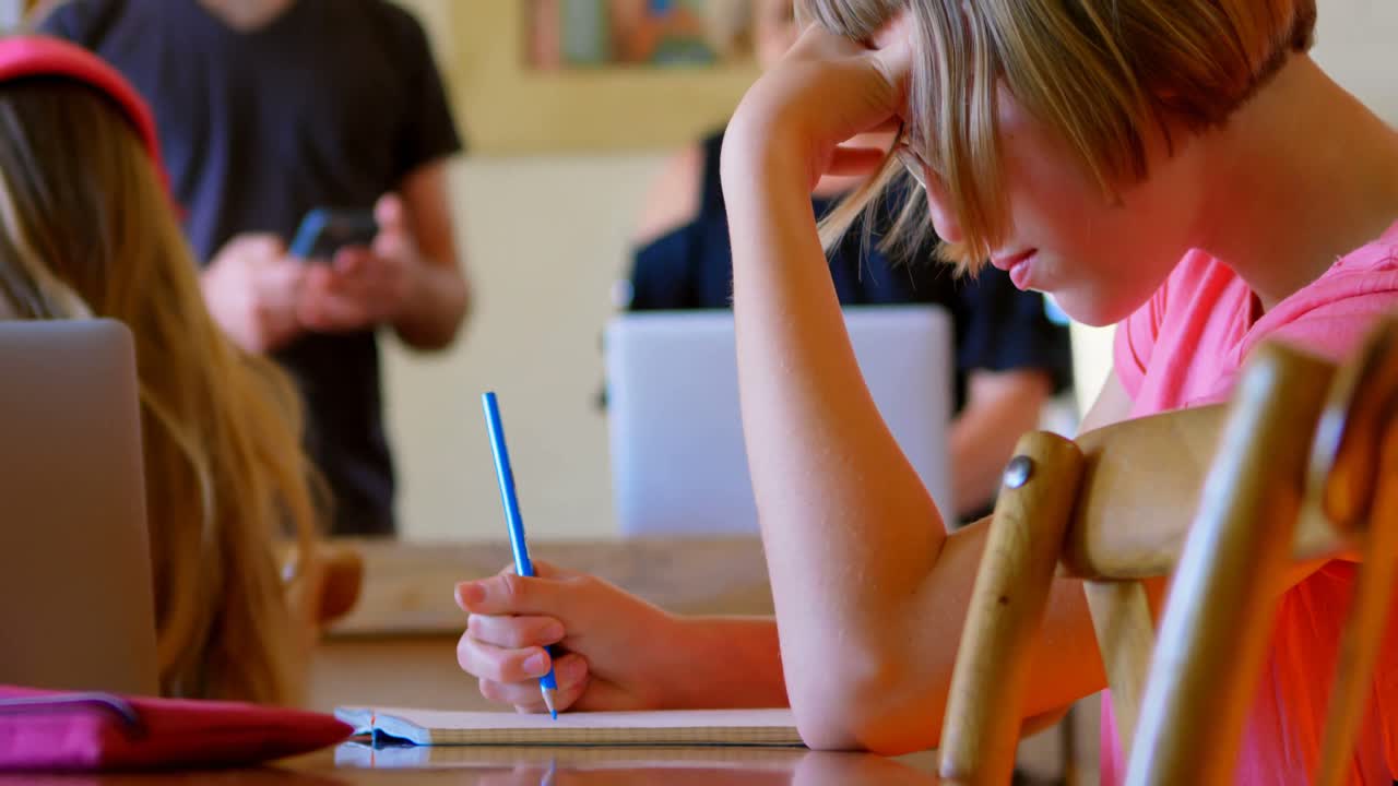 Girl doing her homework at home 4k