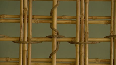 bamboo screen in wall of tokonoma alcove of japanese teahouse