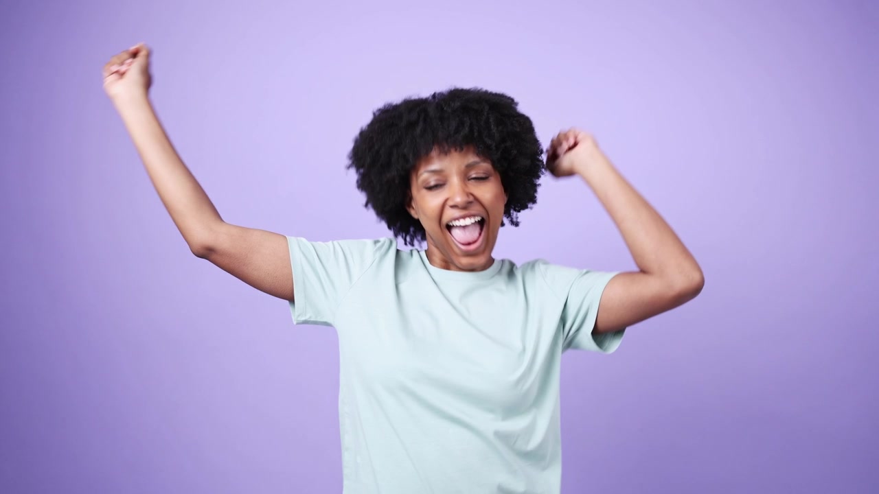 Joyful African American Woman Laughing and Gesturing with Excitement