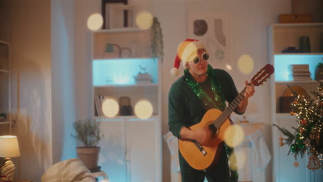 young man enjoys plucking guitar at home