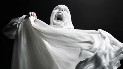 a black and white photo of a ghost with its mouth open