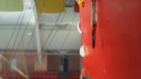 man rock climbing on indoor climbing wall