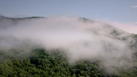 dramatic drone footage of the mist filled smoky mountains in north carolina in the united states