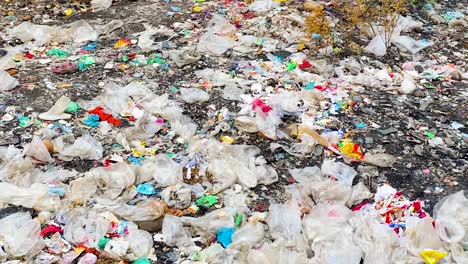 Endless-number-of-trash-at-local-landfill,-panning-view