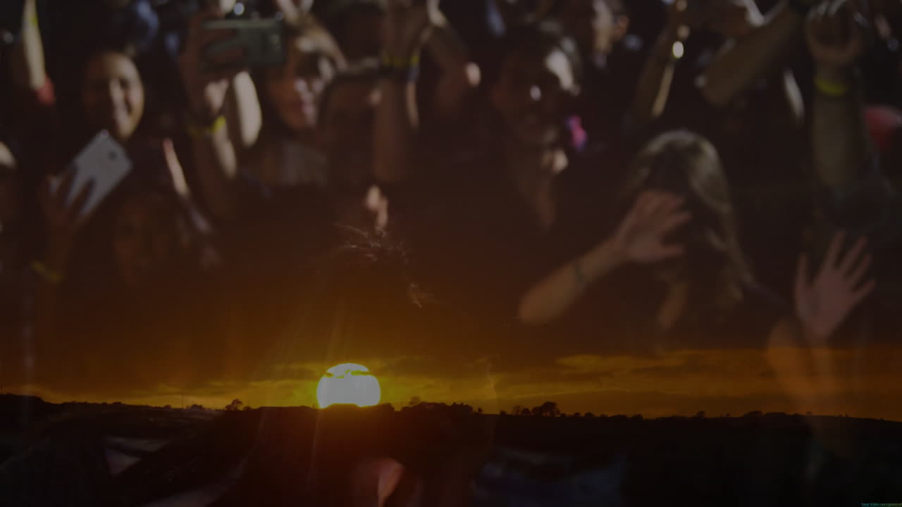 Female singer singing into microphone on stage with fans, showing sunset horizon for music industry