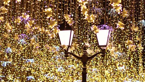 street lantern with decorative christmas garlands. new year and christmas celebration.