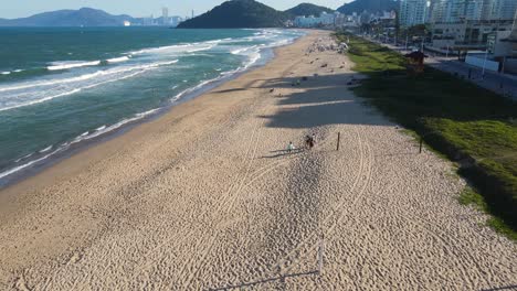 drone flying above the beach in praia brava in brazil