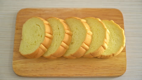 potatoes bread sliced on wood board