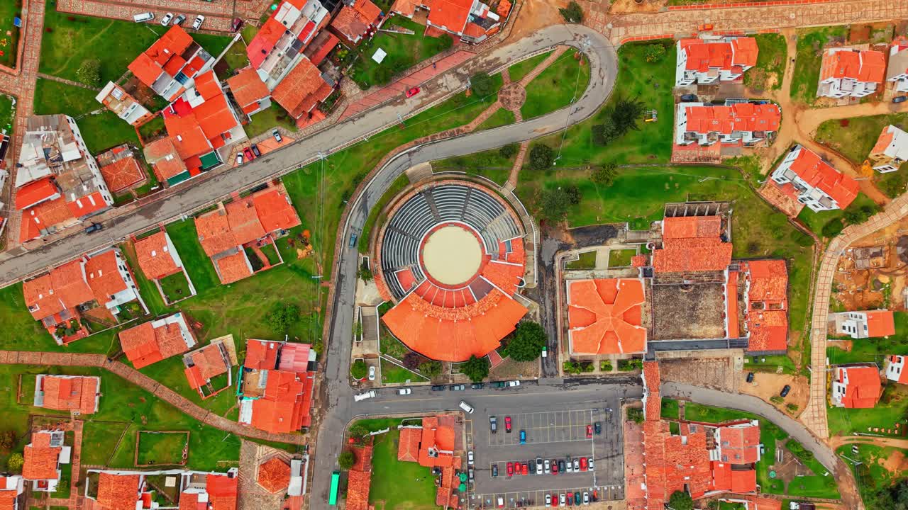 Aerial orbit establishing in the bullring of La Maestranza in the town of Guatavita, with orange tile roofs in a small tourist town in Cundinamarca, Colombia.