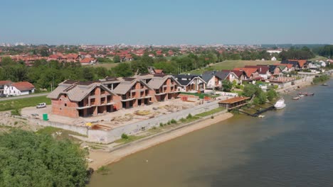 beautiful riverside luxury houses being built in belgrade serbia, aerial view