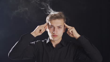 smoke comes out of the head of the thoughtful teenager.