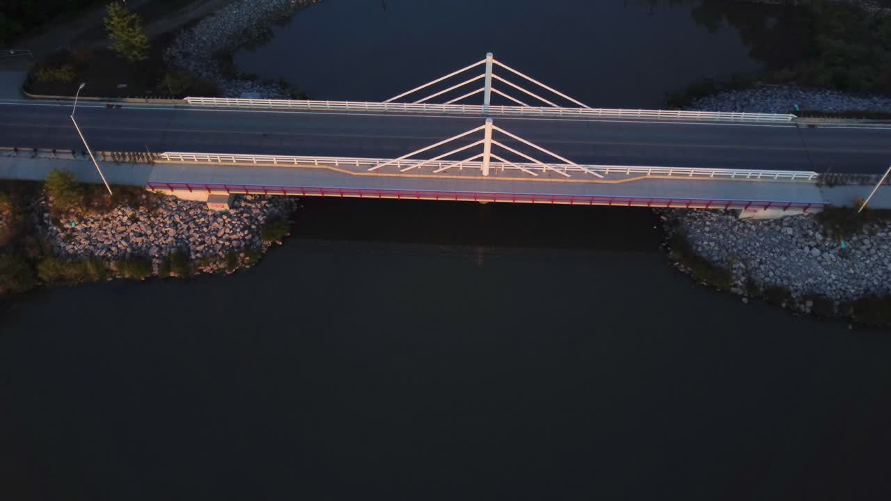 A bridge with reflection in a ecosystem within ontario canada in the morning during sunrise