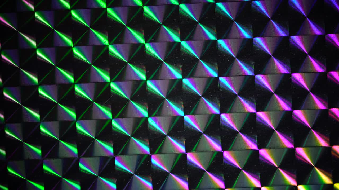 real shiny led light moving over silver rainbow holo foil