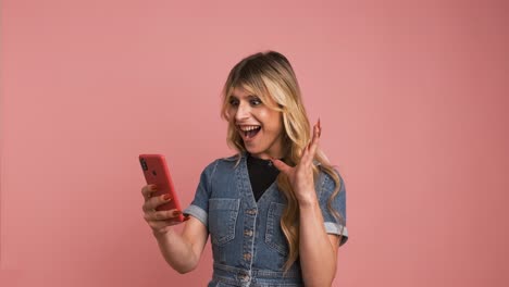 excited transgender woman using smartphone and screaming while celebrating good news
