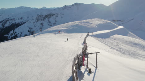 skiers and snowboarders, ski resort in saalbach-hinterglemm, austria - aerial drone shot