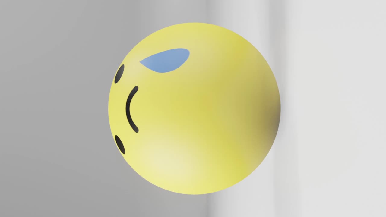 Sad reaction facebook button in the shape of giant rubber ball rolling