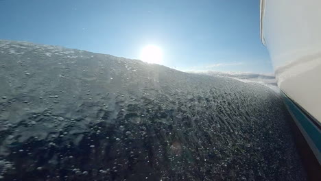 spray and foam from the wake of boat