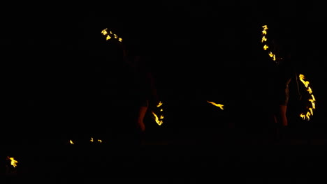 fire jugglers at night