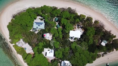 drone flying up from low isles, island in the great battier reef in australia