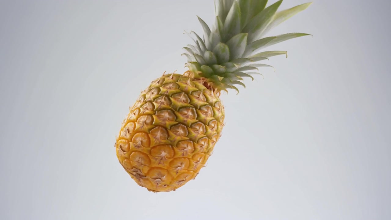 Fresh Pineapple Rotating Against a Clean White Background