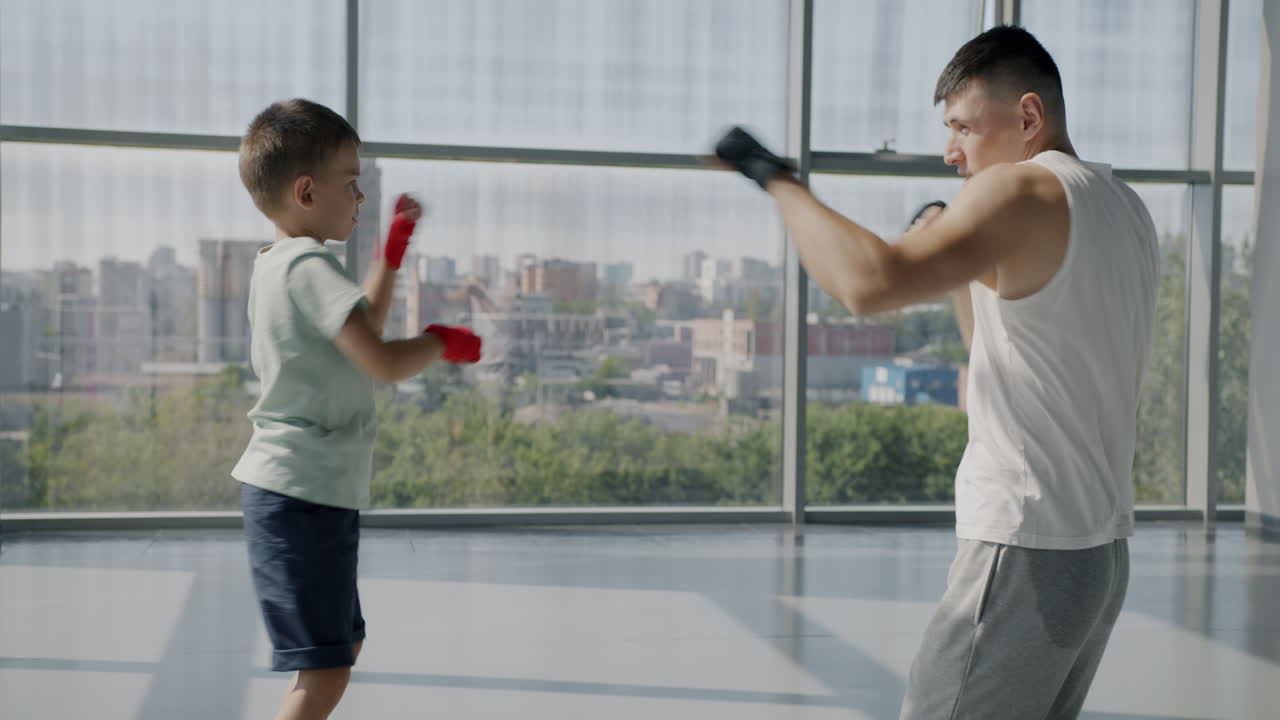 Father and son boxing training