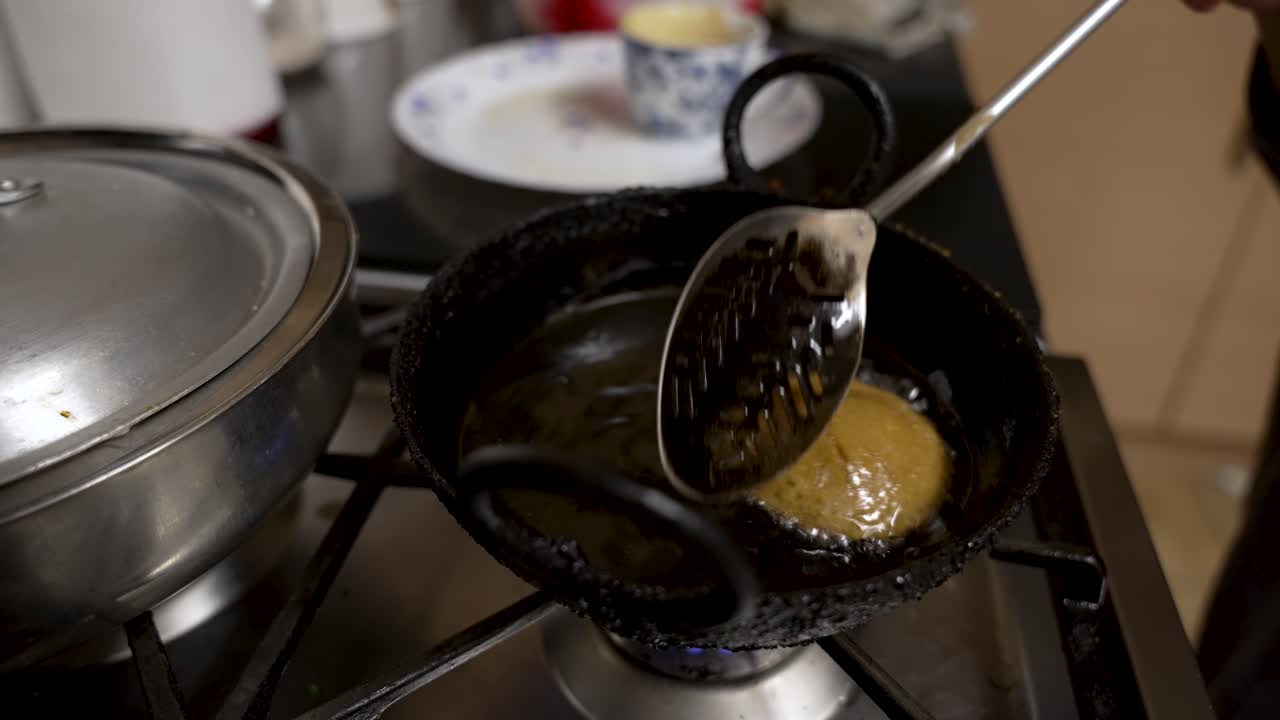 Metal Slotted Spoon Gently Moving Floating Fresh Guror Handesh In Pan Filled With Hot Oil