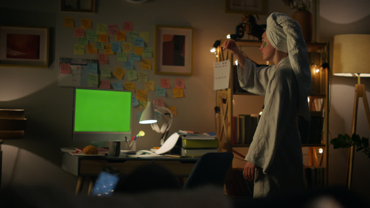 Remote worker explaining mockup device. Freelance girl talking at chromakey pc