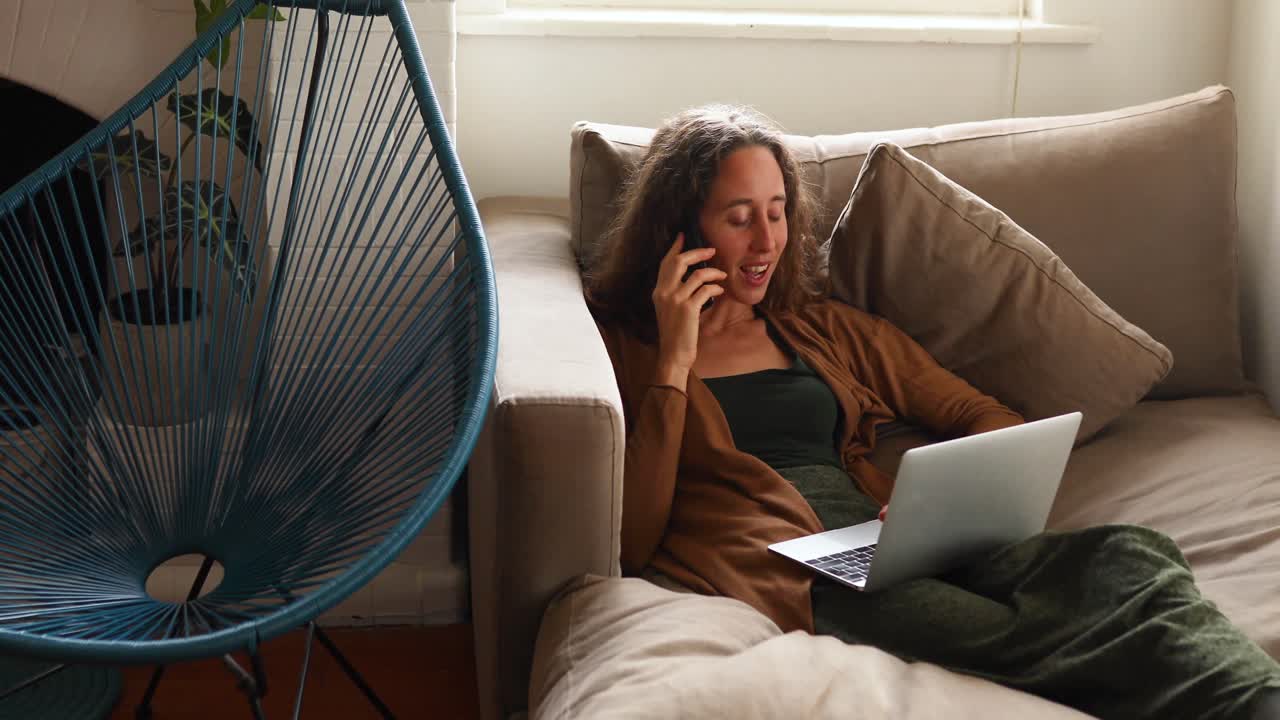 Caucasian woman using her phone at home