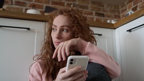 close up and handheld video of anxious young caucasian woman using mobile phone.