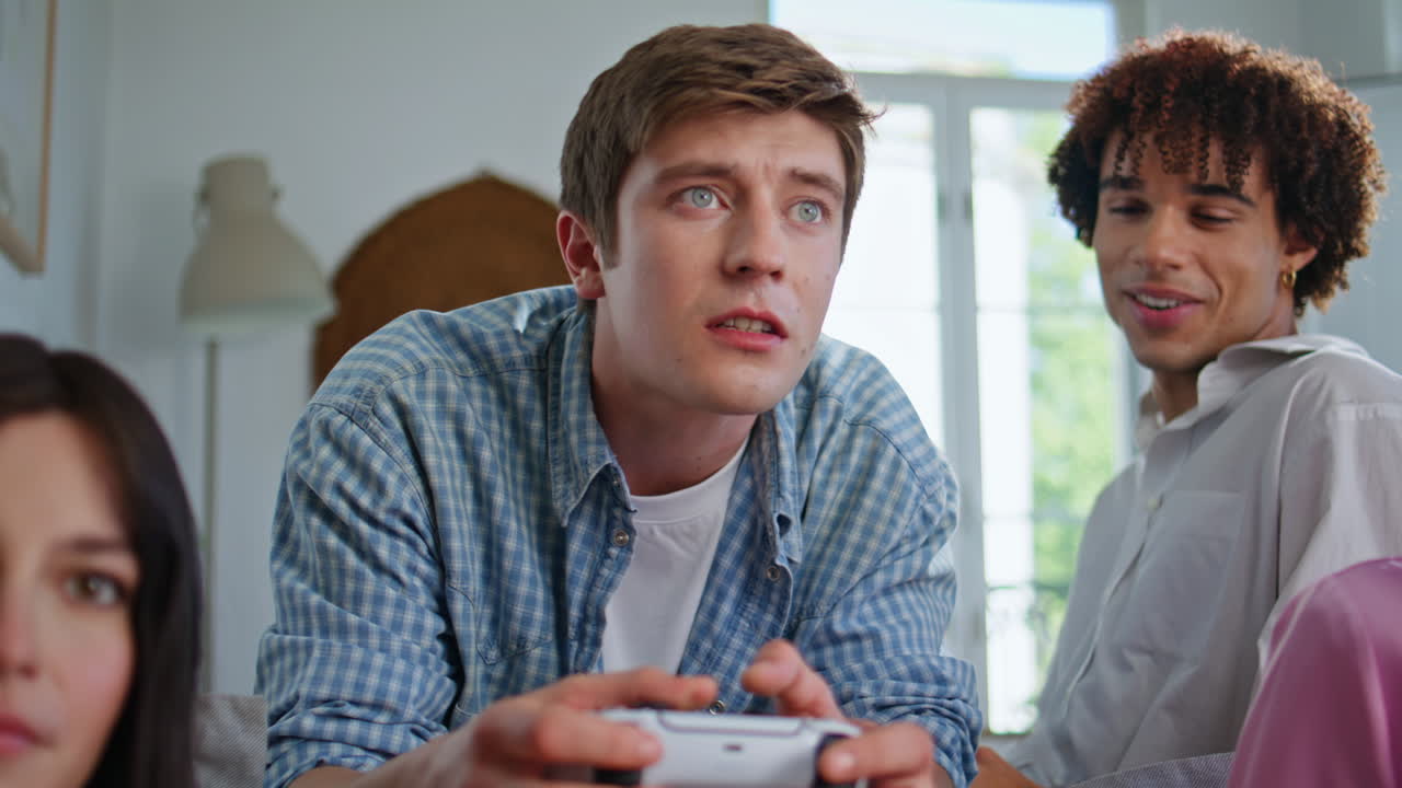 Competitive player enjoying videogame at sofa closeup. People playing console