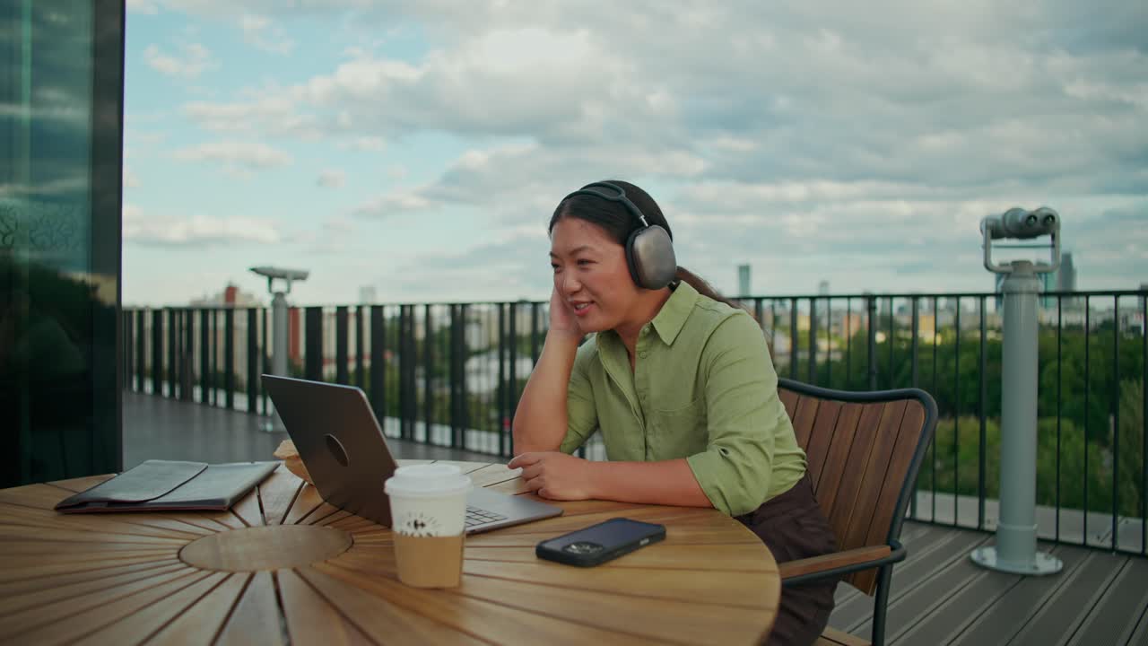 Woman Working Outdoors on Laptop