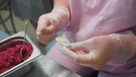 making pierogi with beet filling