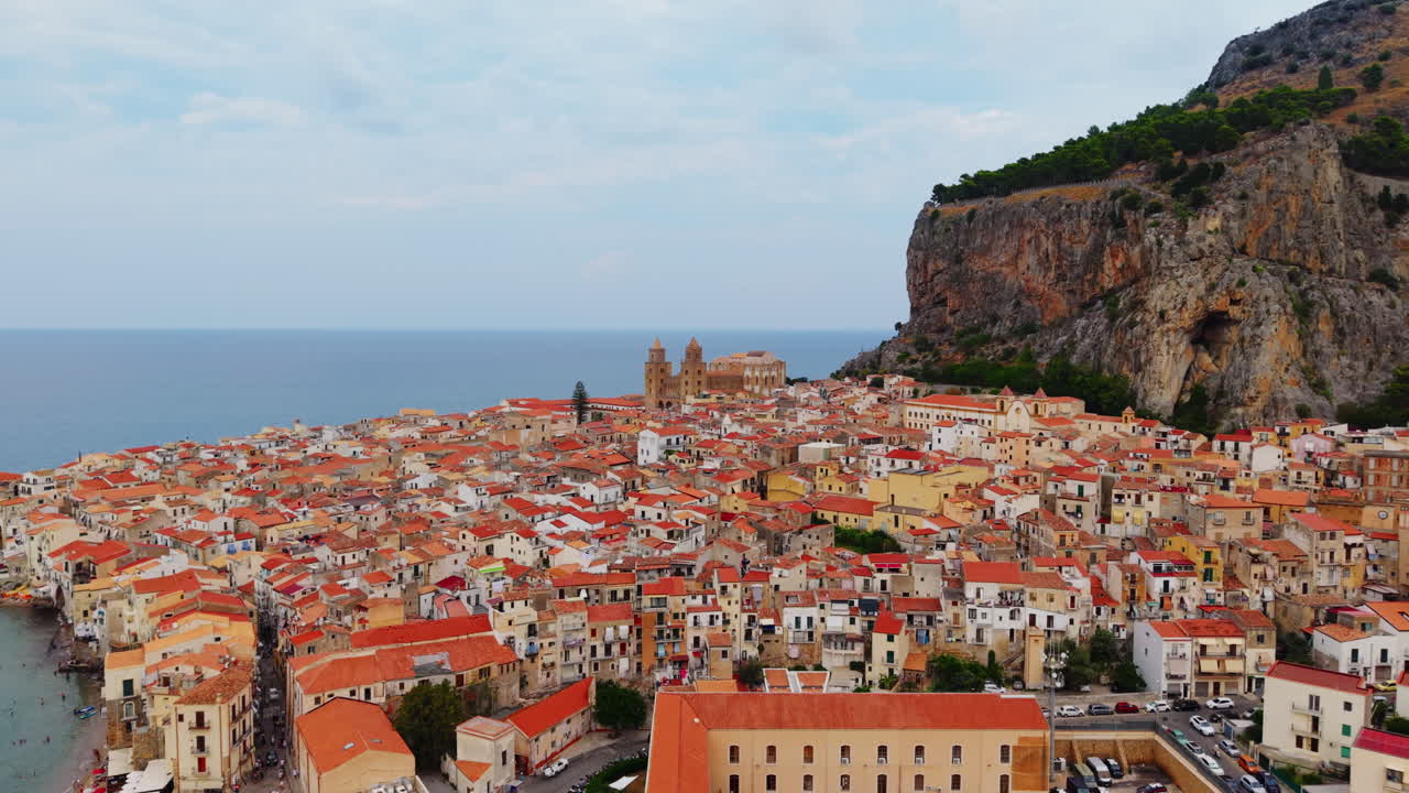 Cefalù aerial, sunset over charming Italian coastal town with mountains