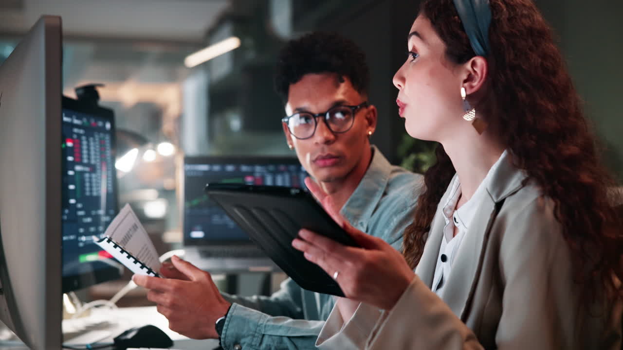 Business People Analyzing Data at Night