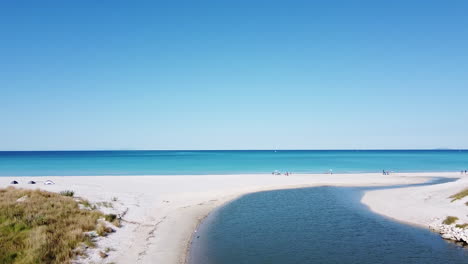 Rosignano-Solvay,-aerial-slowly-entering-view-of-Spiagge-Bianche