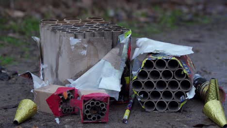 used burnt fireworks, firecrackers on pavement after explosion in holiday