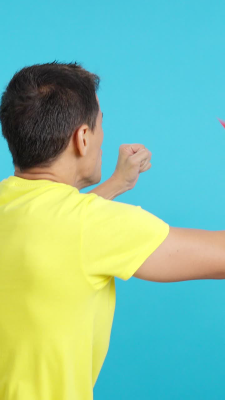 Rear view of a man waving a south african pennant