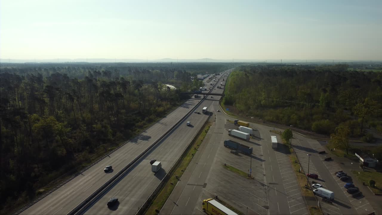 Aerial View of Highway with Traffic and Parking Lot